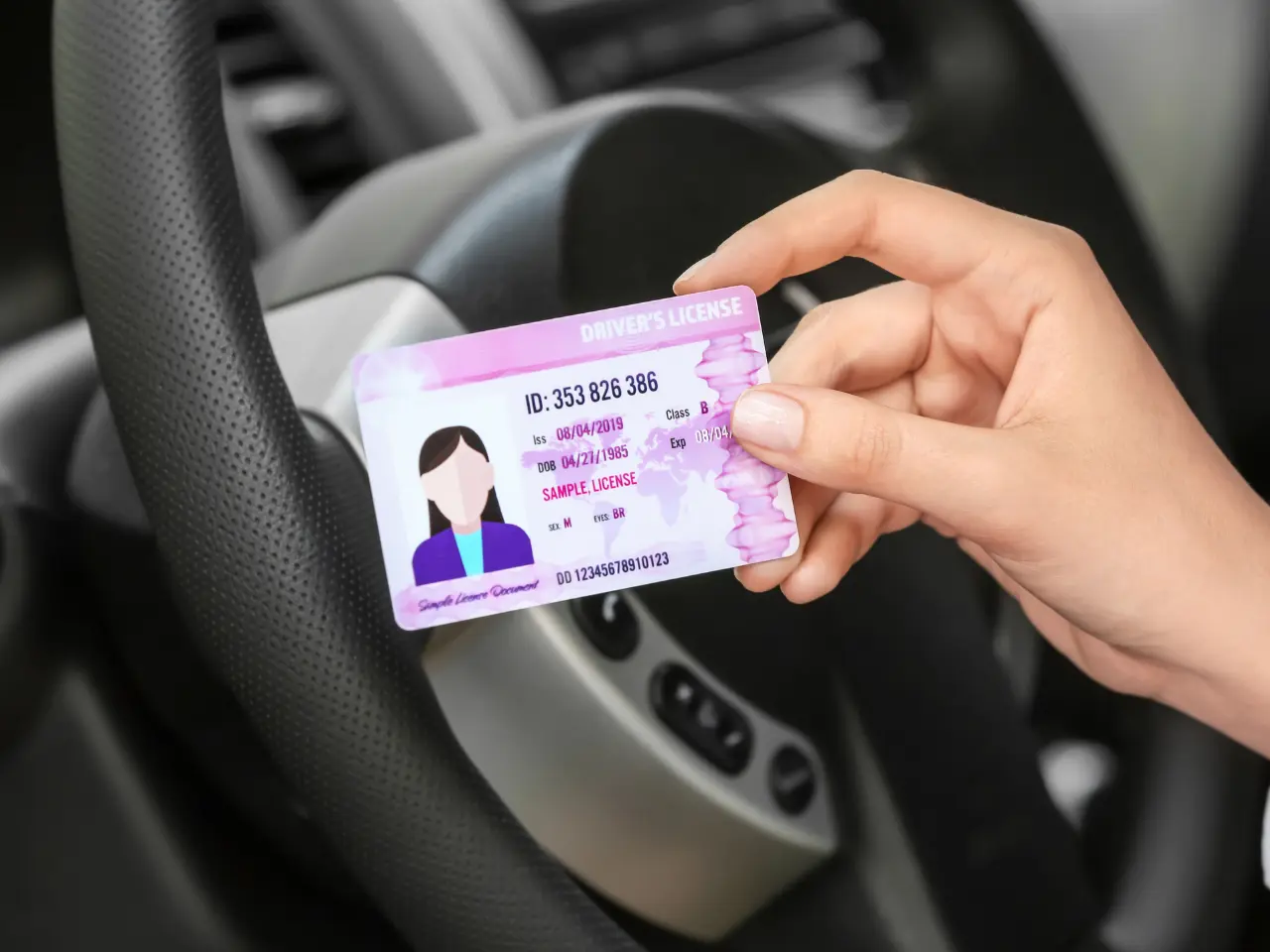 Driver receiving a licence after completing the driver licensing process in British Columbia