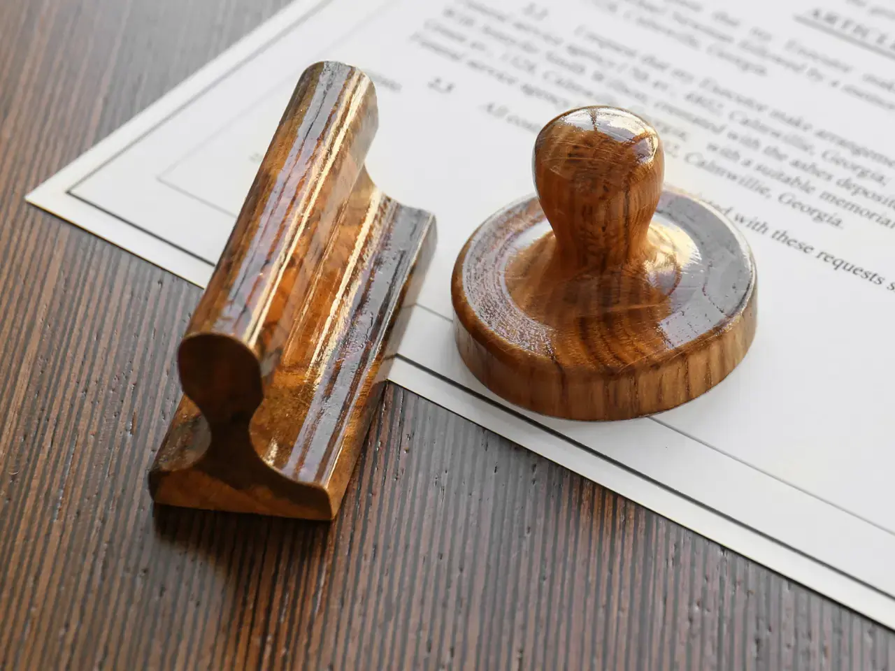 Notary stamp and seal placed on legal documents.