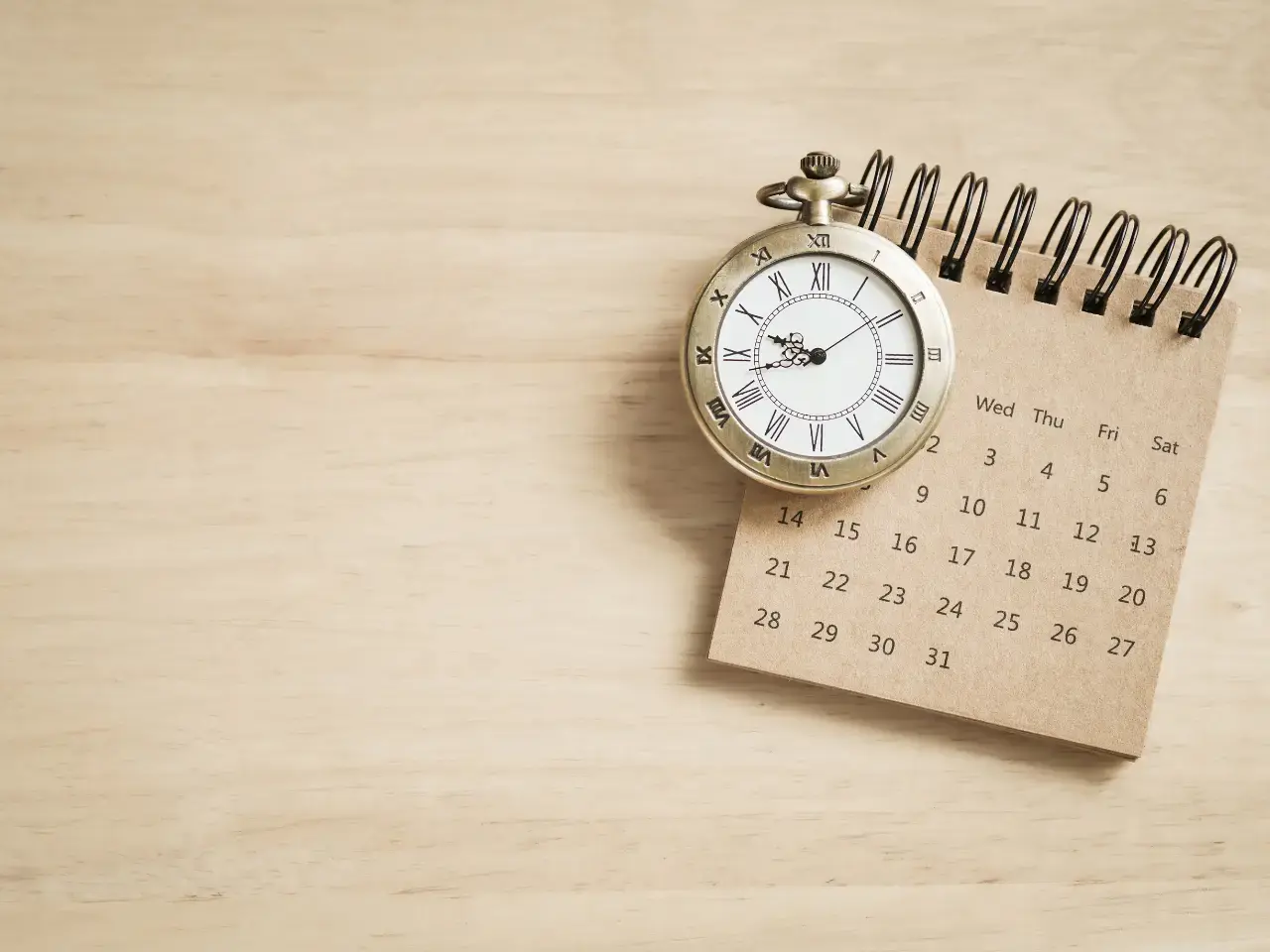 Calendar and clock representing document processing timelines.