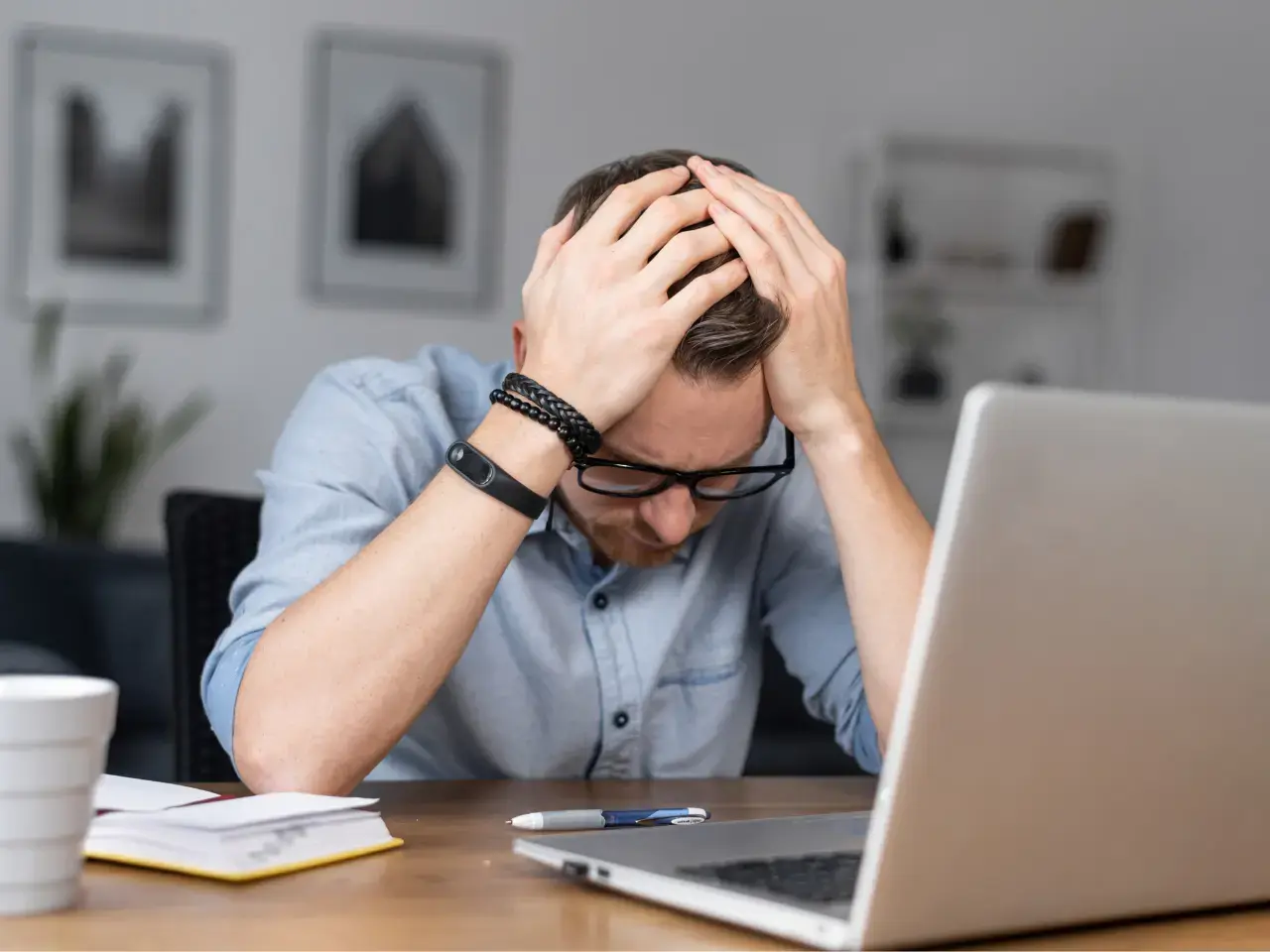 Person stressed while handling document requirements.