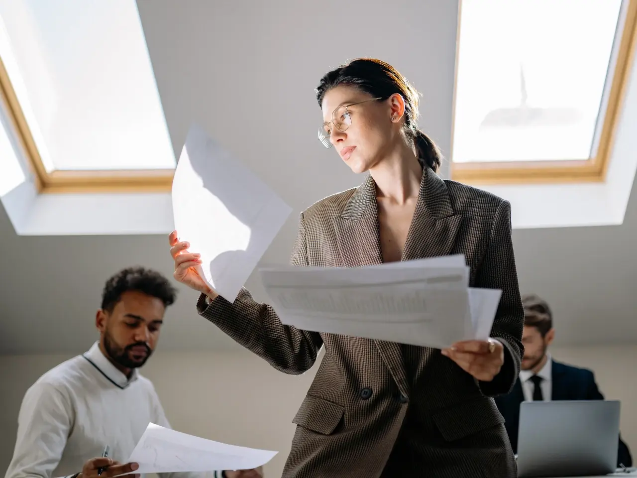 Professionals reviewing documents for international employment or application.