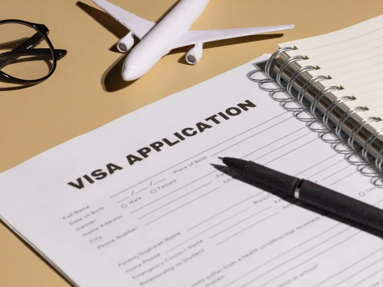 Preparing a visa application form for UAE travel requirements from Canada.