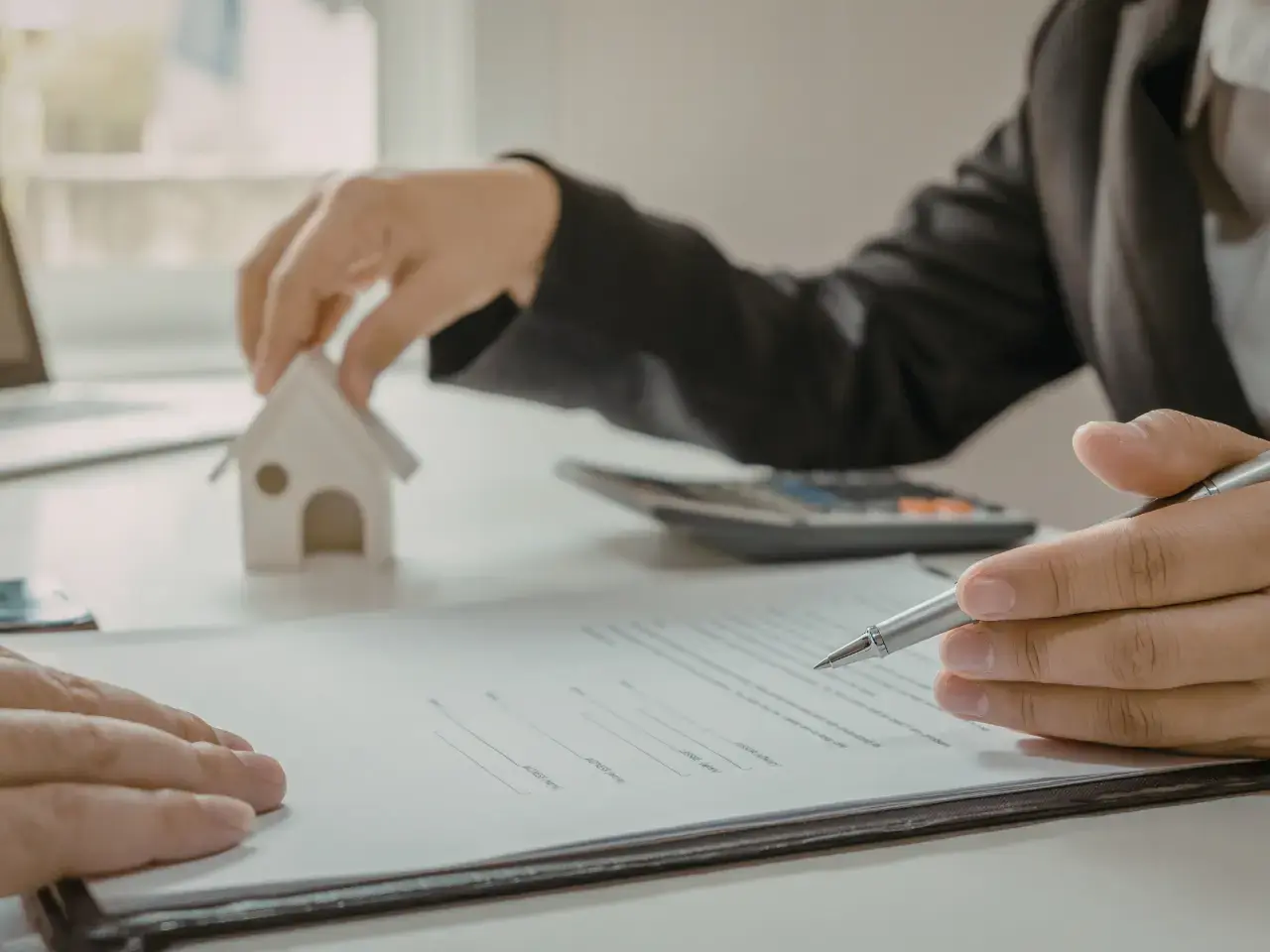 Signing a purchase agreement and preparing documents for closing in Mexico.