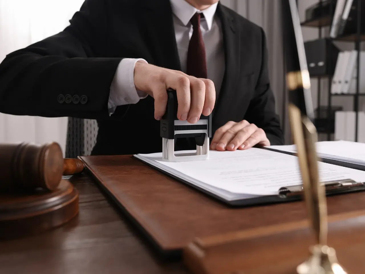 Notary stamping documents for police certificate authentication.