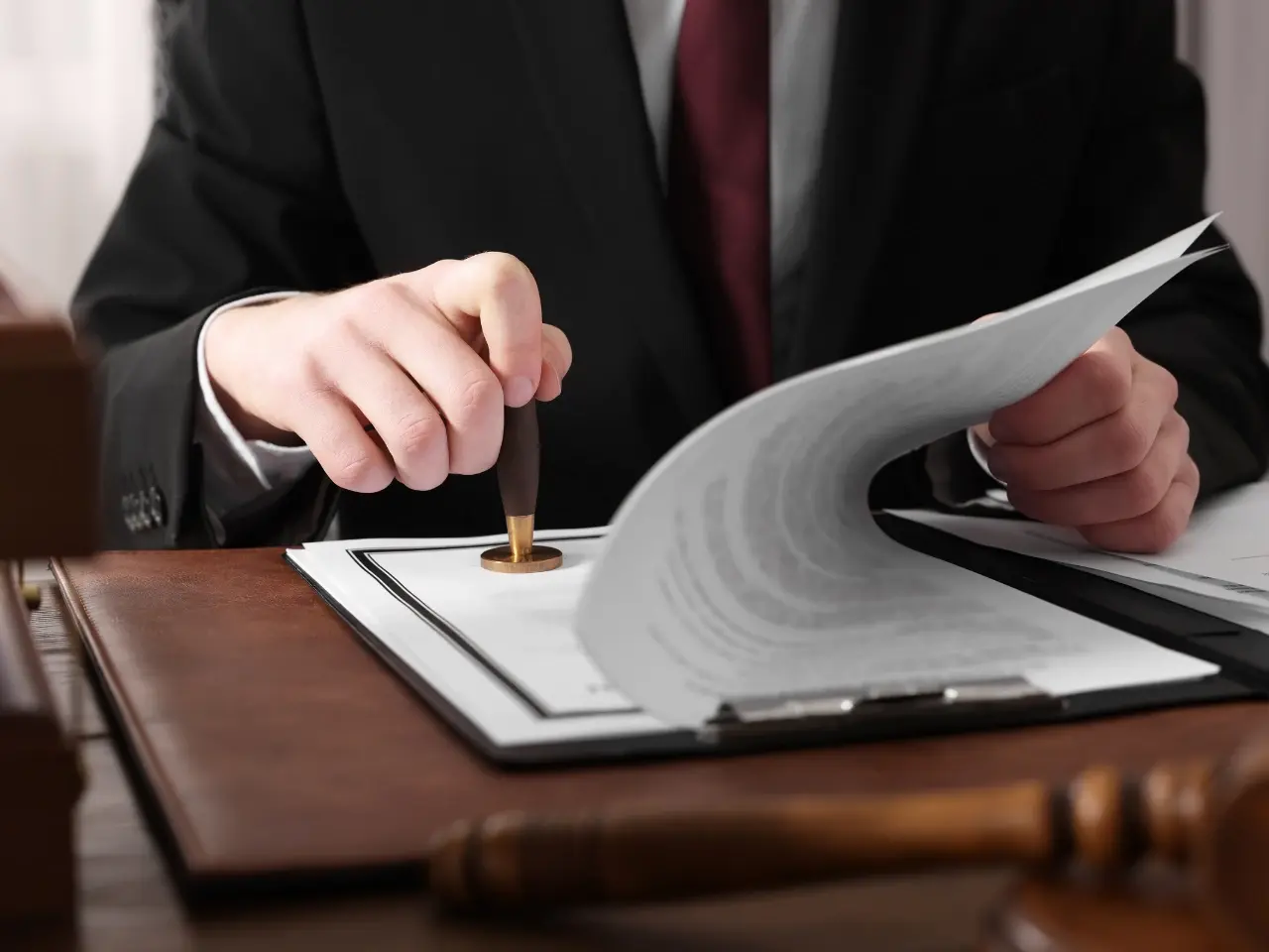 Notary stamping multiple documents for attestation or apostille.