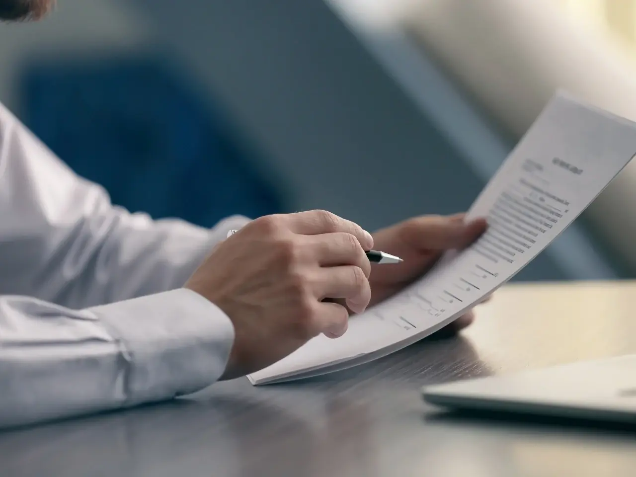 Person reviewing official documents related to an Ontario birth certificate application.