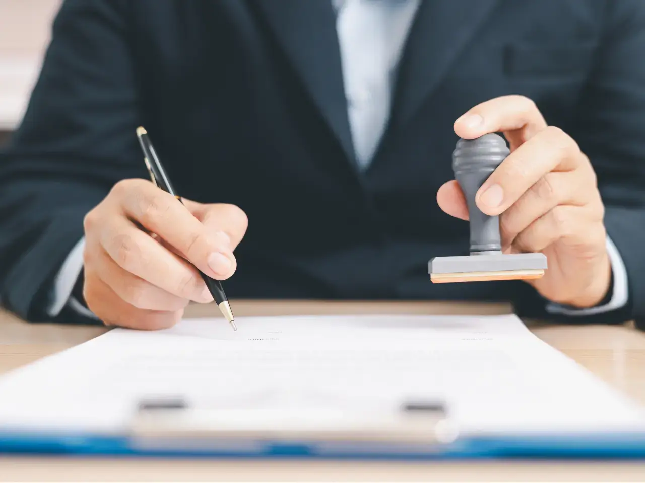 Signing official paperwork for death certificate verification or correction.