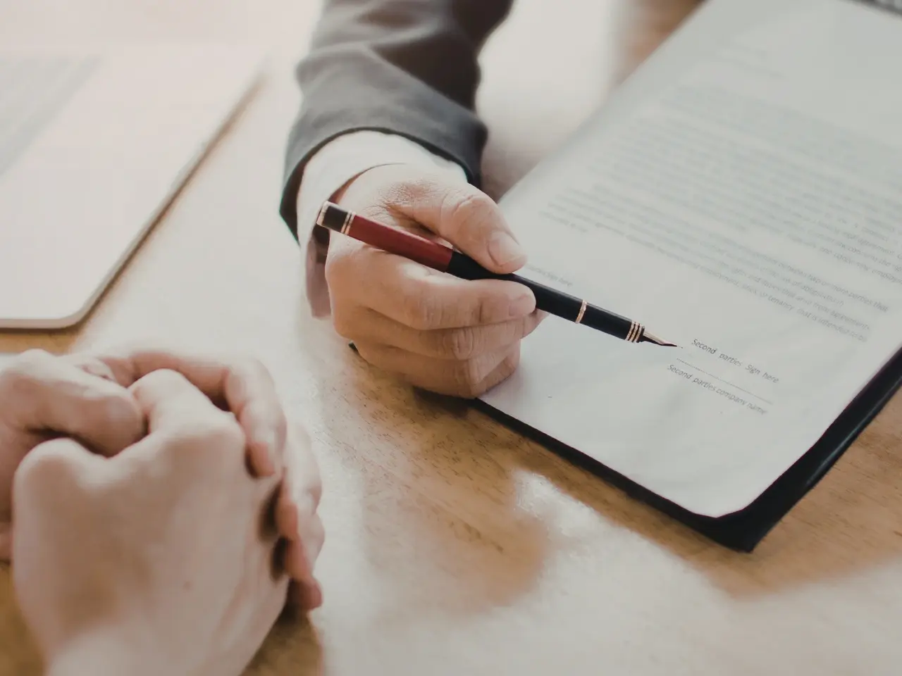 Signing official documents to finalize a divorce certificate request.