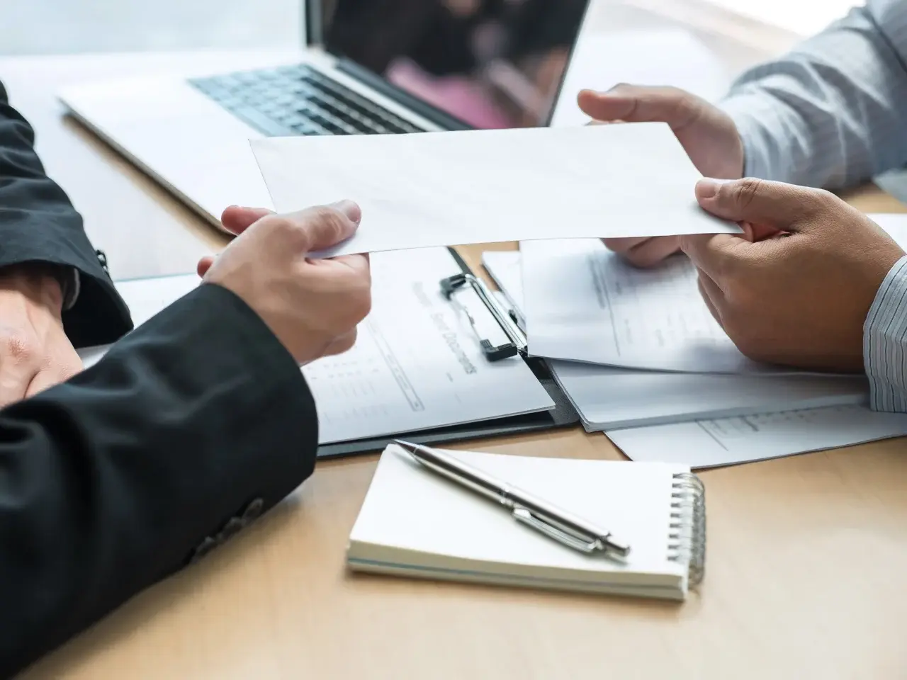 Couple reviewing paperwork related to an Ontario marriage certificate application.