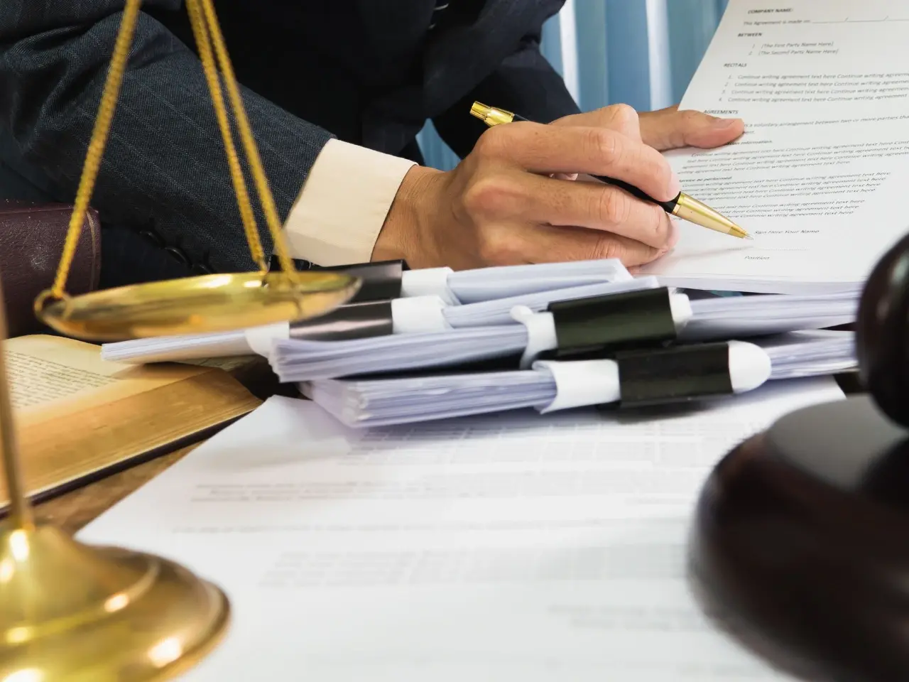 Close-up of legal paperwork being signed, illustrating legal requirements for a valid power of attorney in Canada.