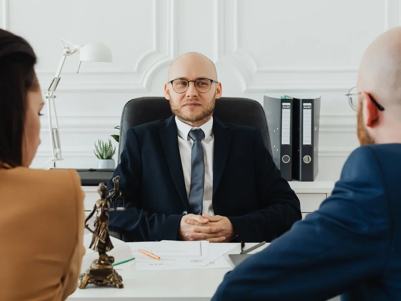 Client meeting with a lawyer to review and sign documents, showing the step-by-step process of getting a power of attorney.