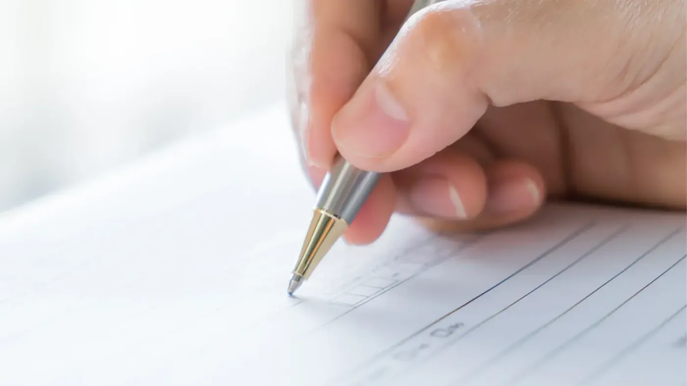 Signing a form for apostille processing.