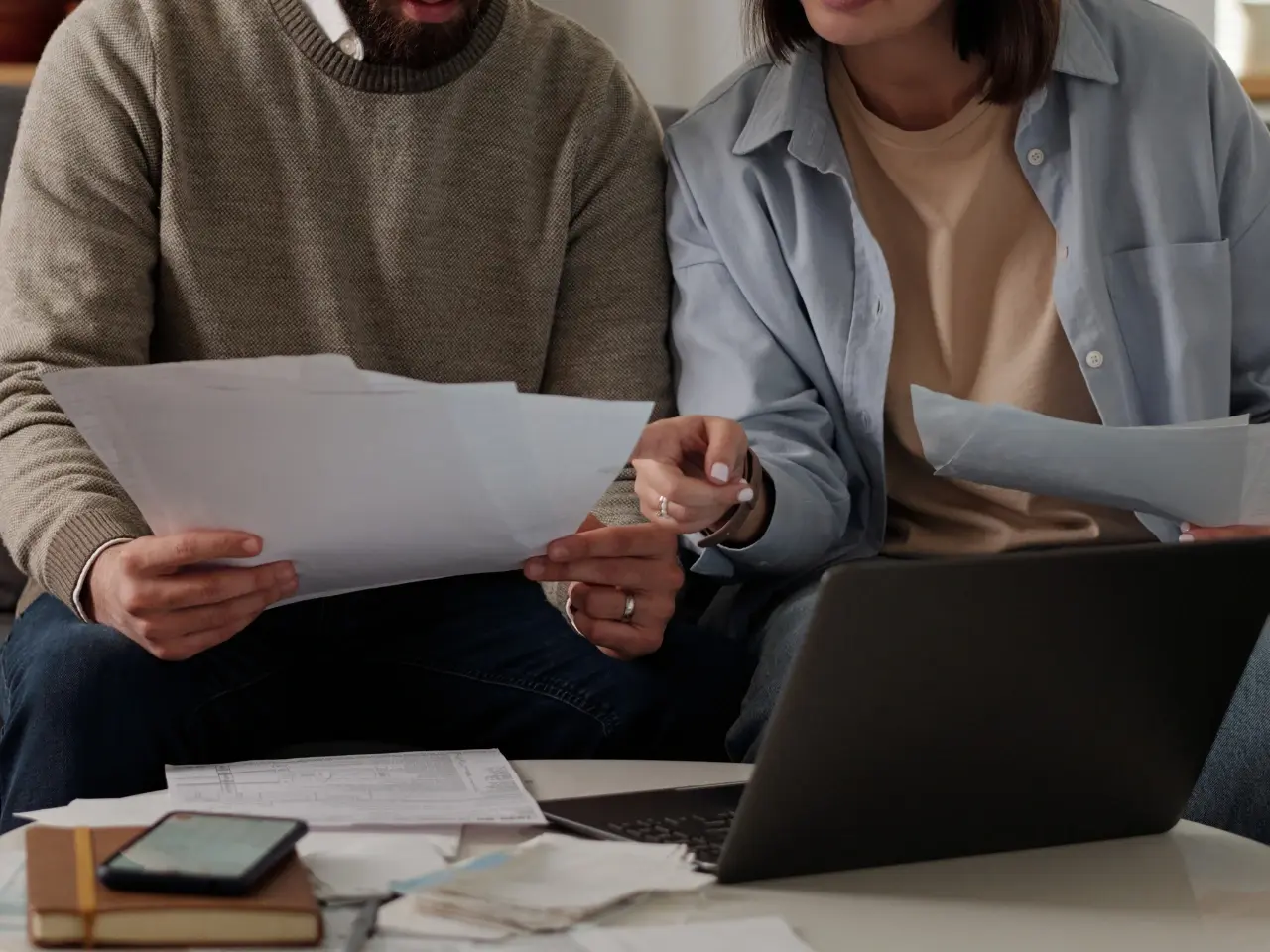 Couple checking the Canadian marriage certificate for authentication