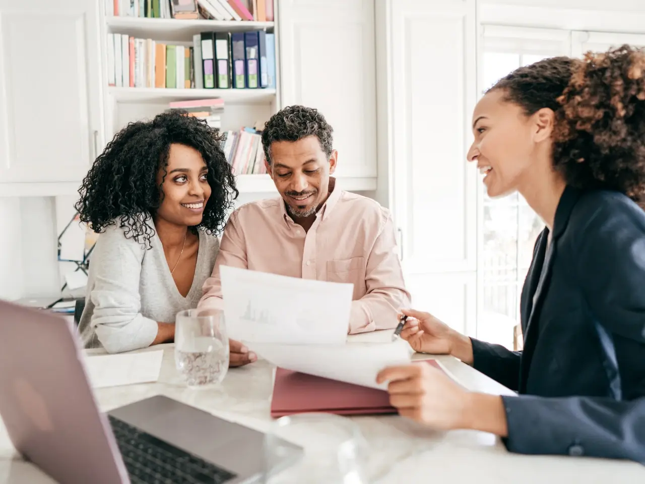 Couple meeting with a legal professional to prepare their Canadian marriage certificate.