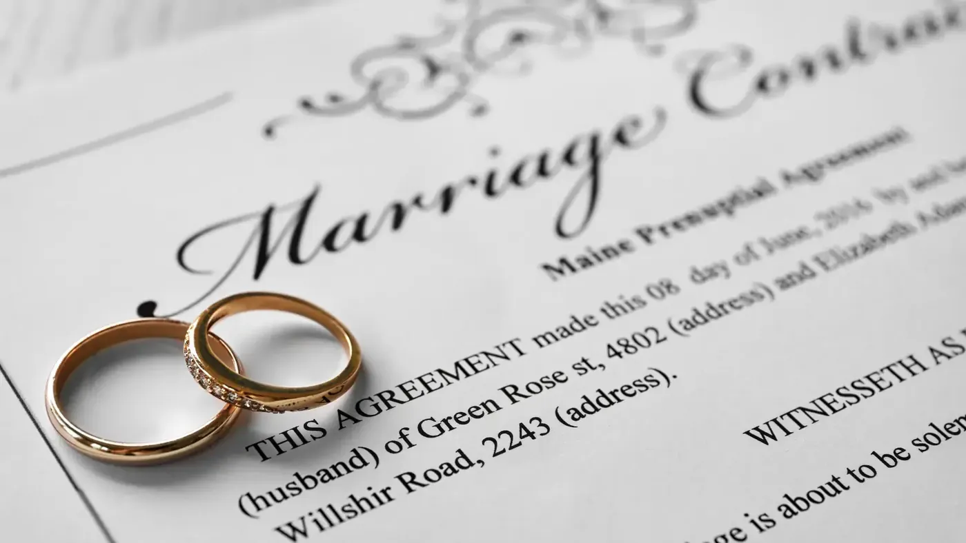 Marriage certificate with wedding rings for the UAE attestation process.