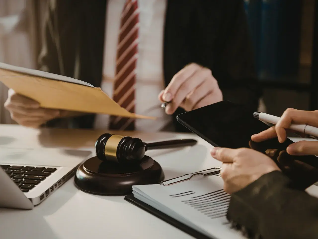 Professional reviewing legal documents with notary tools, representing secure document notarization and apostille services in Canada.