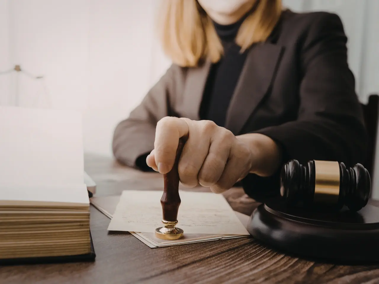 Officer stamping legal documents, illustrating why foreign authorities require proof that a Canadian is legally free to marry.