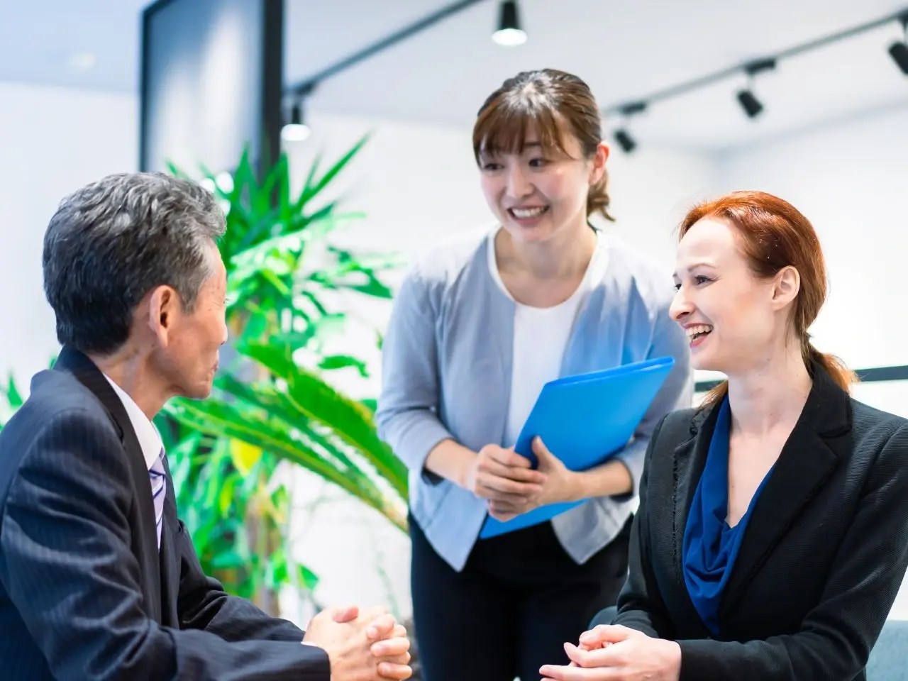 Group of international professionals in a business meeting, representing cross-cultural communication supported by certified translation or interpretation services.