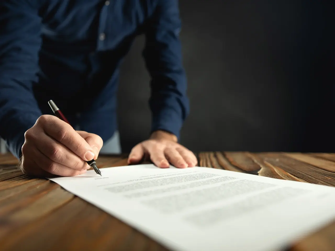 Signing an official document for international use.