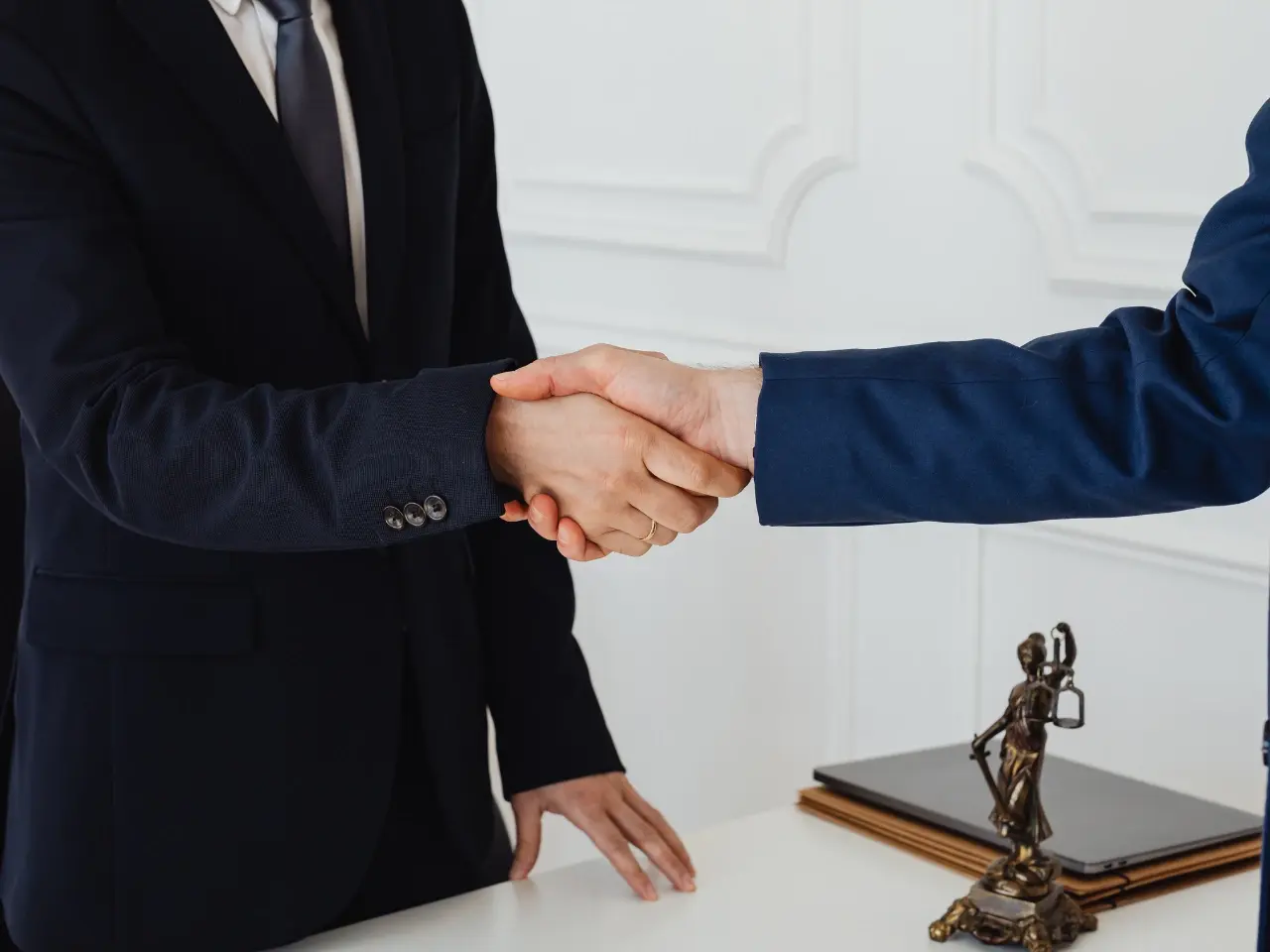 Handshake after completing the document attestation process.
