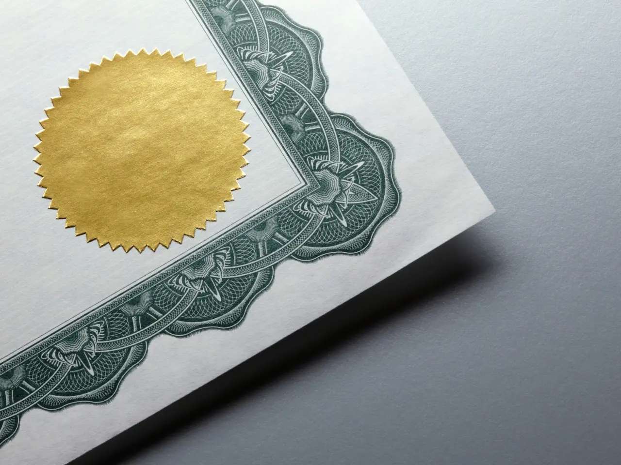 Close-up of a certificate with a gold foil seal, symbolizing official validation, legalization, or certified translation.