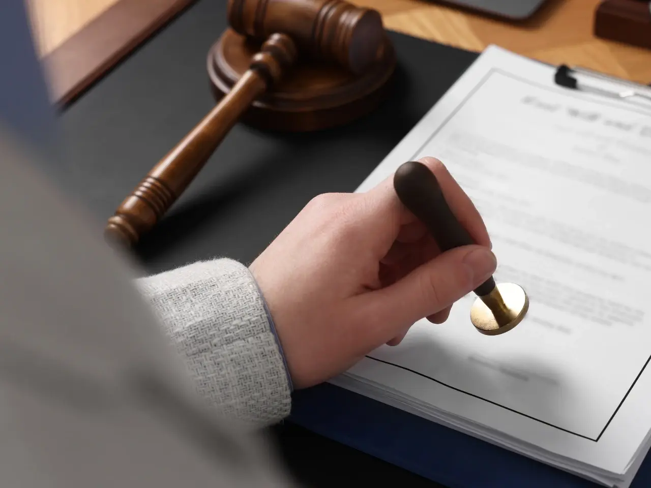 Notary stamping a legal document for apostille preparation.