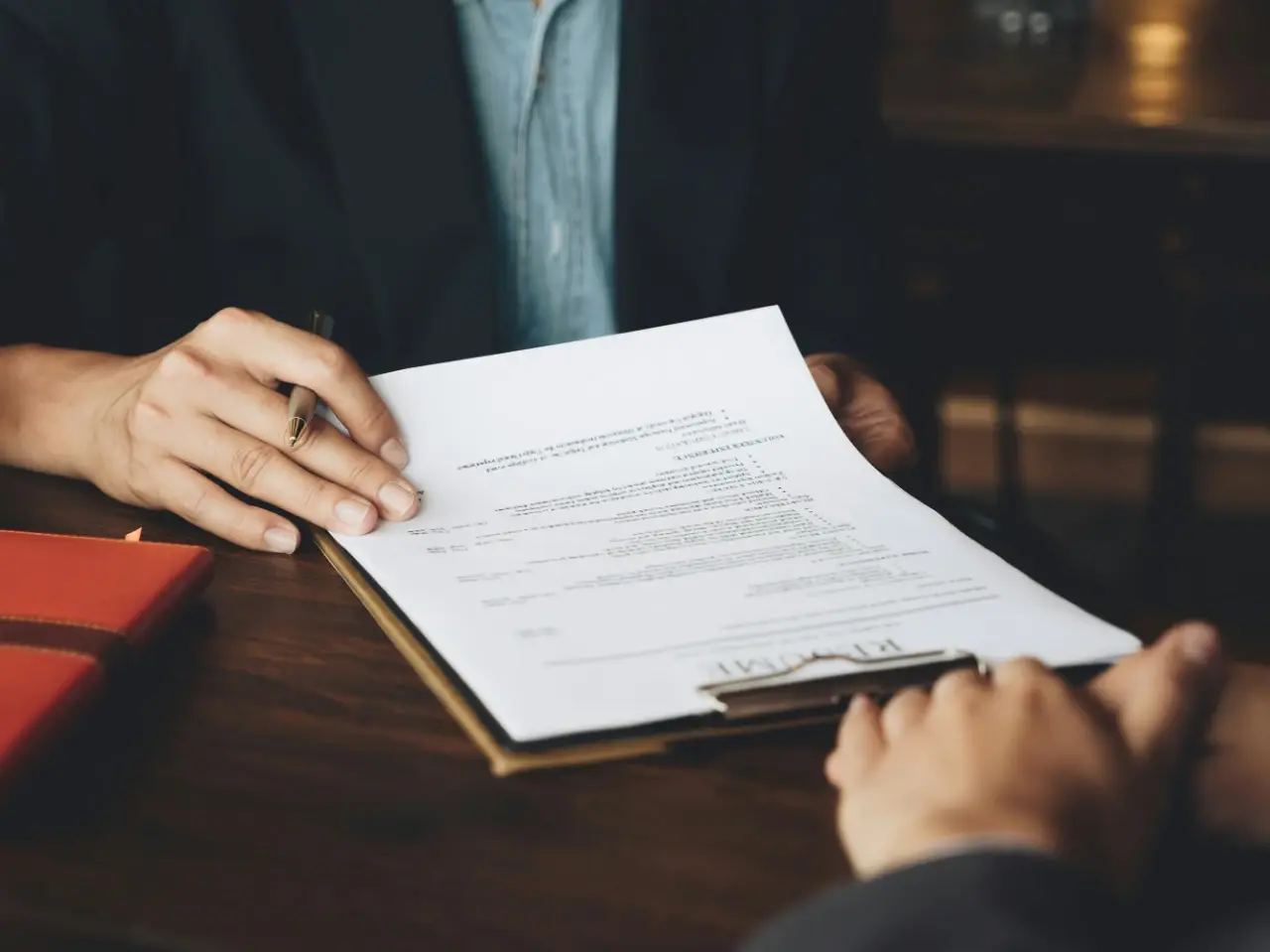 Official representative reviewing the document before issuing an apostille certificate in Canada.