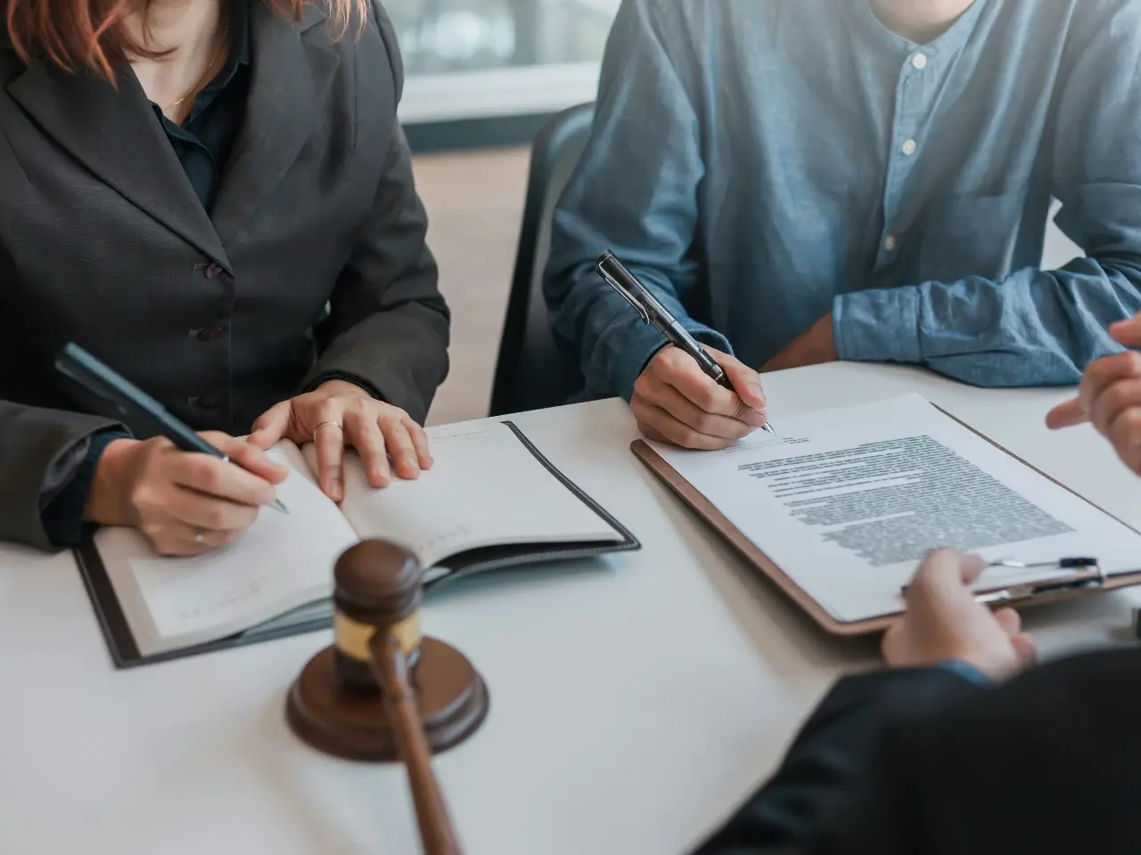 Lawyer and client signing documents in a non-signatory country of the Apostille Convention.