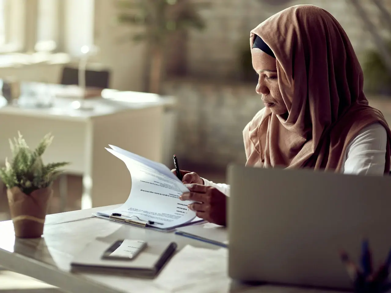 Woman reviewing a document requiring attestation.