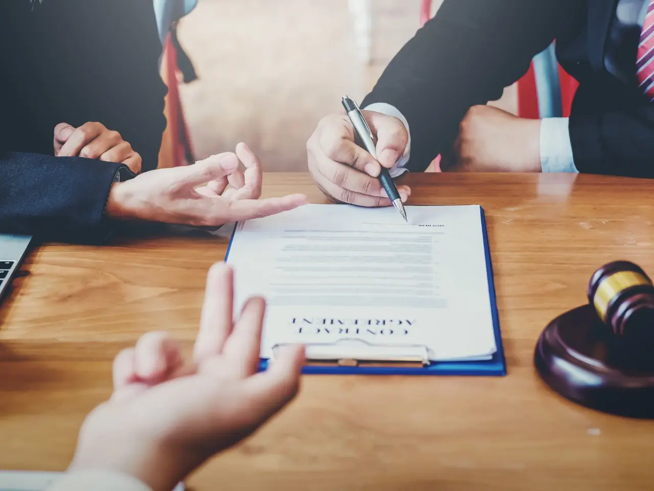 Officials reviewing and signing Canadian documents to illustrate how the Apostille Convention simplifies cross-border authentication.