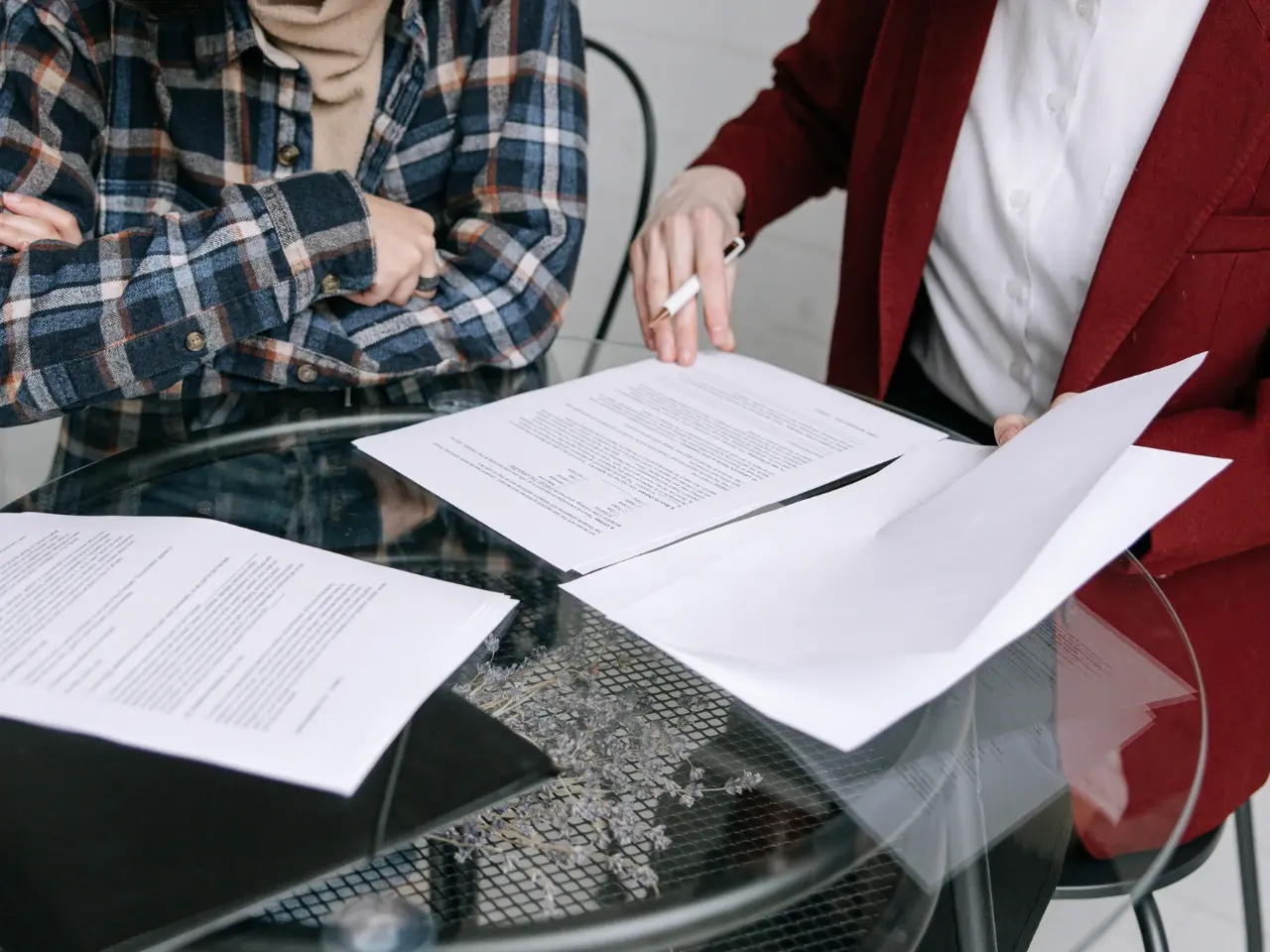 Group reviewing official paperwork, representing the different types of Canadian documents eligible for apostilles.