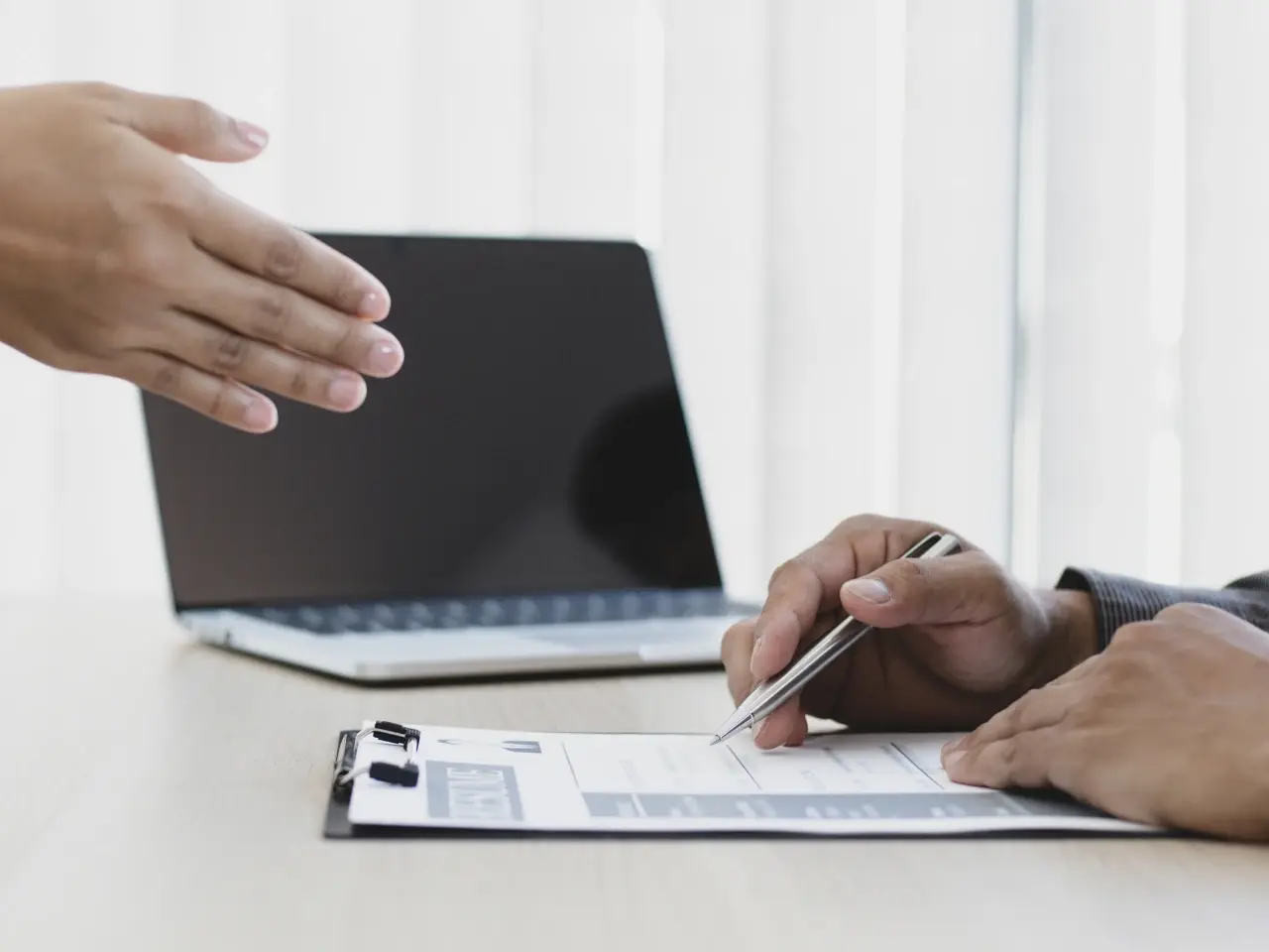 Client submitting documents to an officer, demonstrating the step-by-step process for obtaining an apostille in Canada.