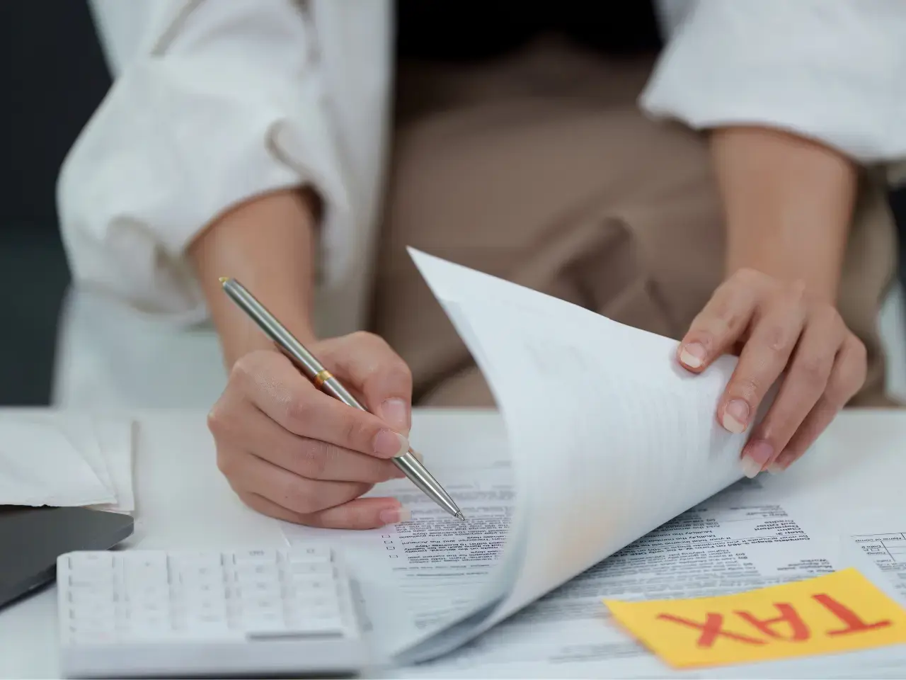 Taxpayer reviewing cross-border income papers, highlighting how a tax residency certificate supports reduced withholding tax under international tax treaties.