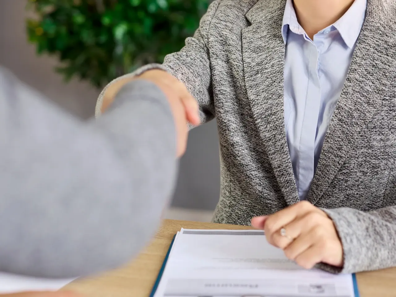 Professional handshake representing embassy attestation and international document approval.