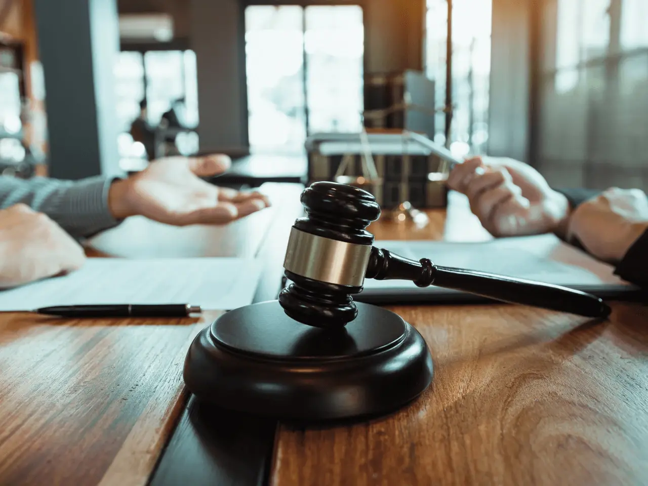 Close-up of a judge’s gavel on a desk with legal documents, symbolizing the legal validation process for obtaining apostilled, authenticated, and legalized certificates in Canada.