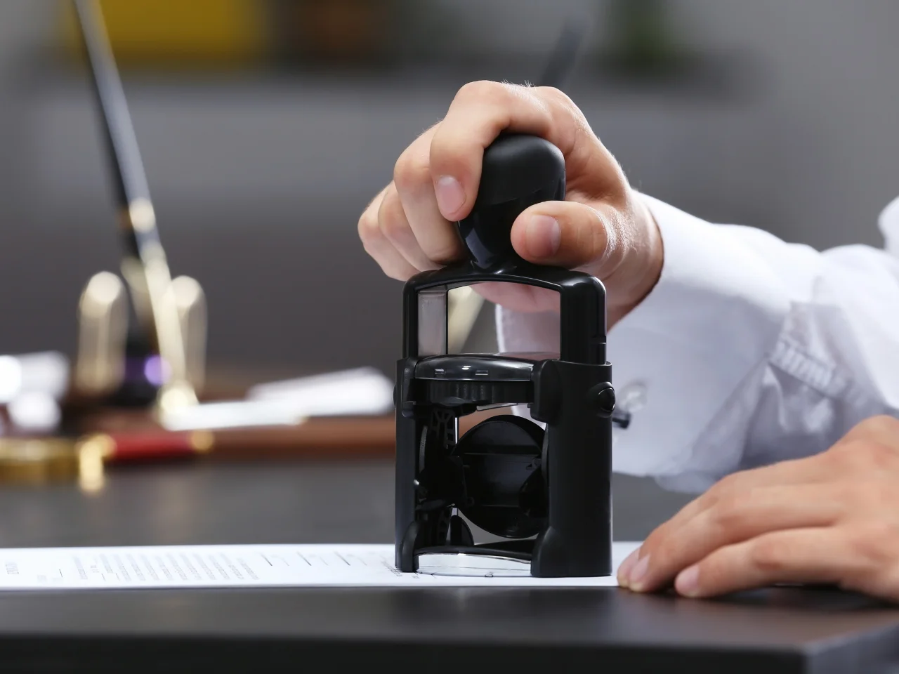 Notary stamping documents for a child’s Canadian citizenship application.