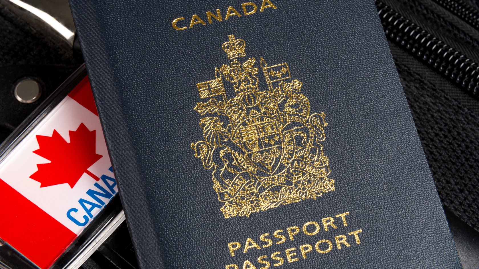 Canadian passport representing dual citizenship and Canadian travel requirements.