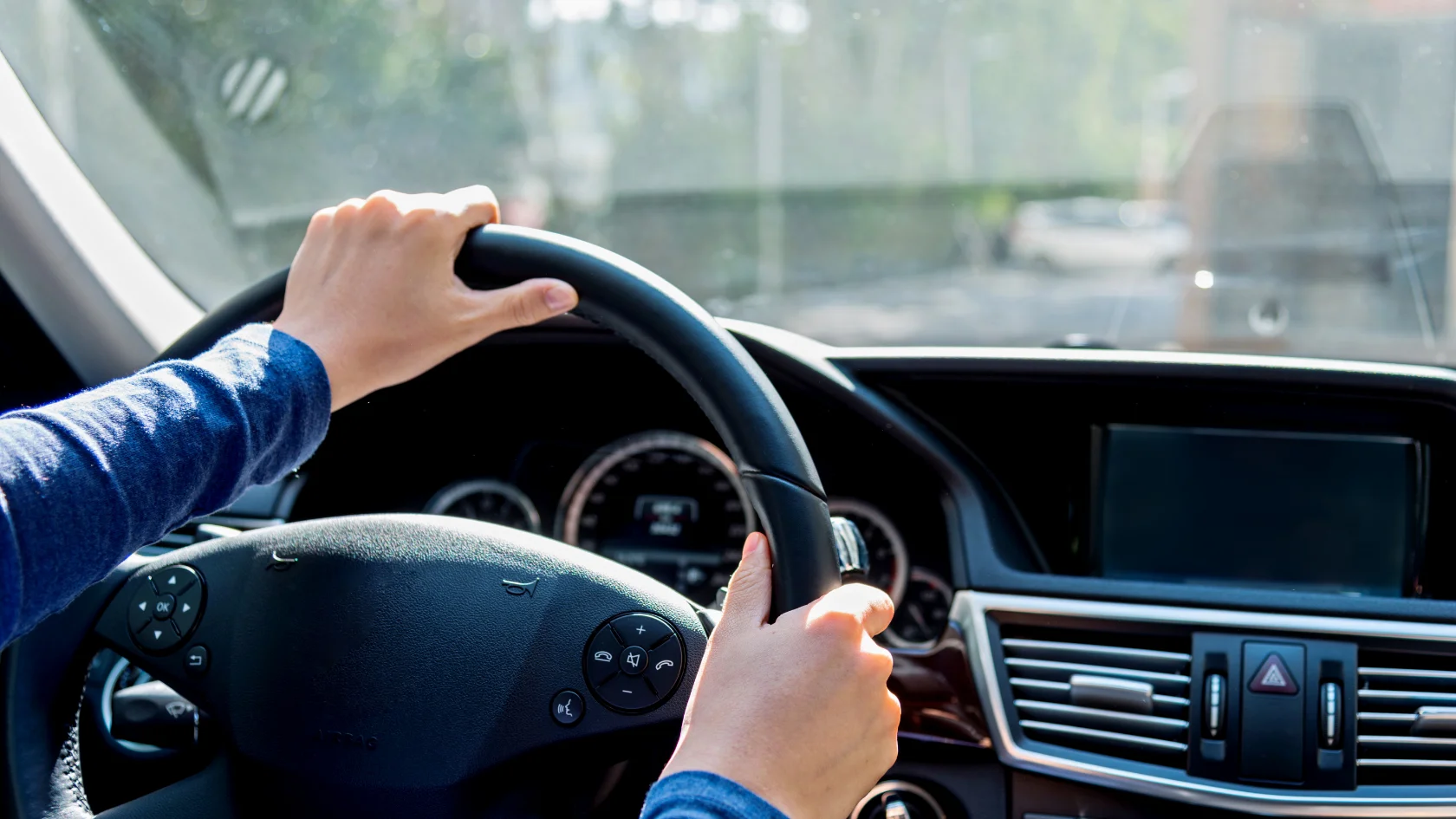 Person driving a vehicle after getting an Alberta driver's licence.