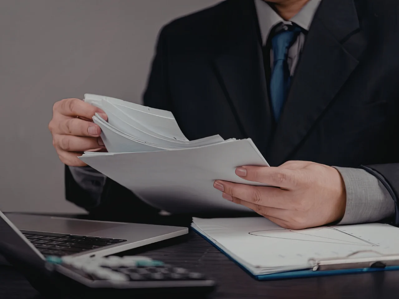 A person examining different immigration documents under the IRCC background check guide.