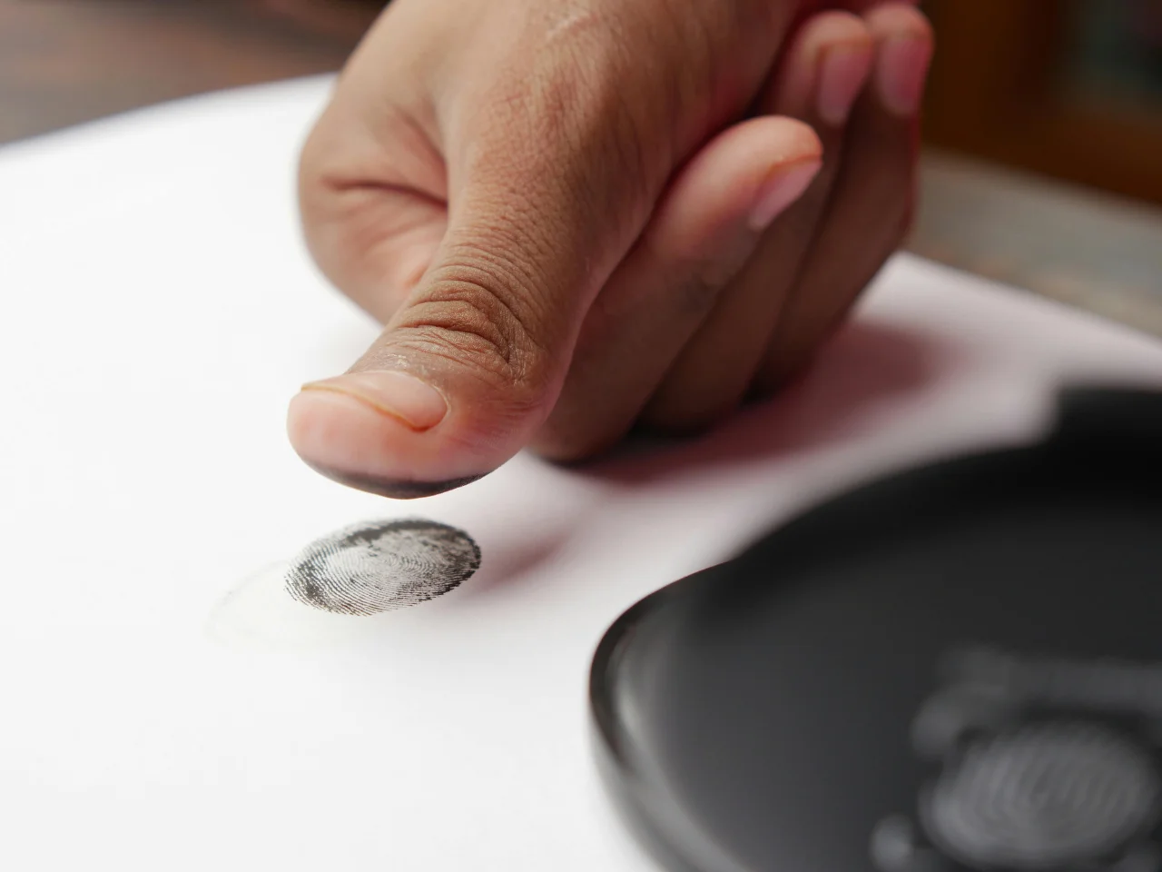 Fingerprint collection for biometric identity verification as part of the IRCC security screening process.
