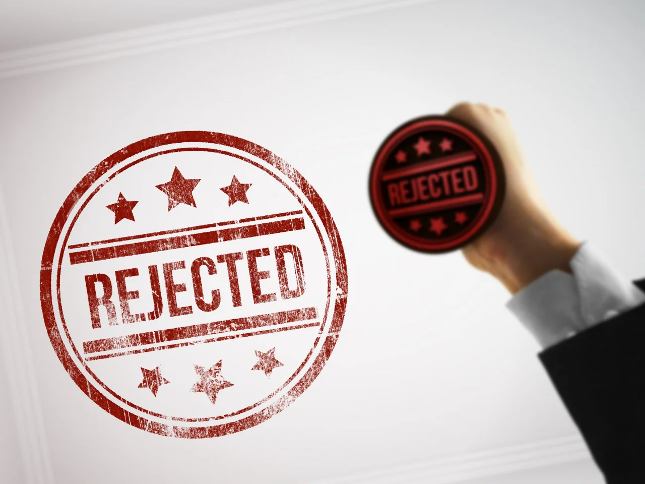 Rejected application stamp representing inadmissibility findings or issues identified during immigration screening.