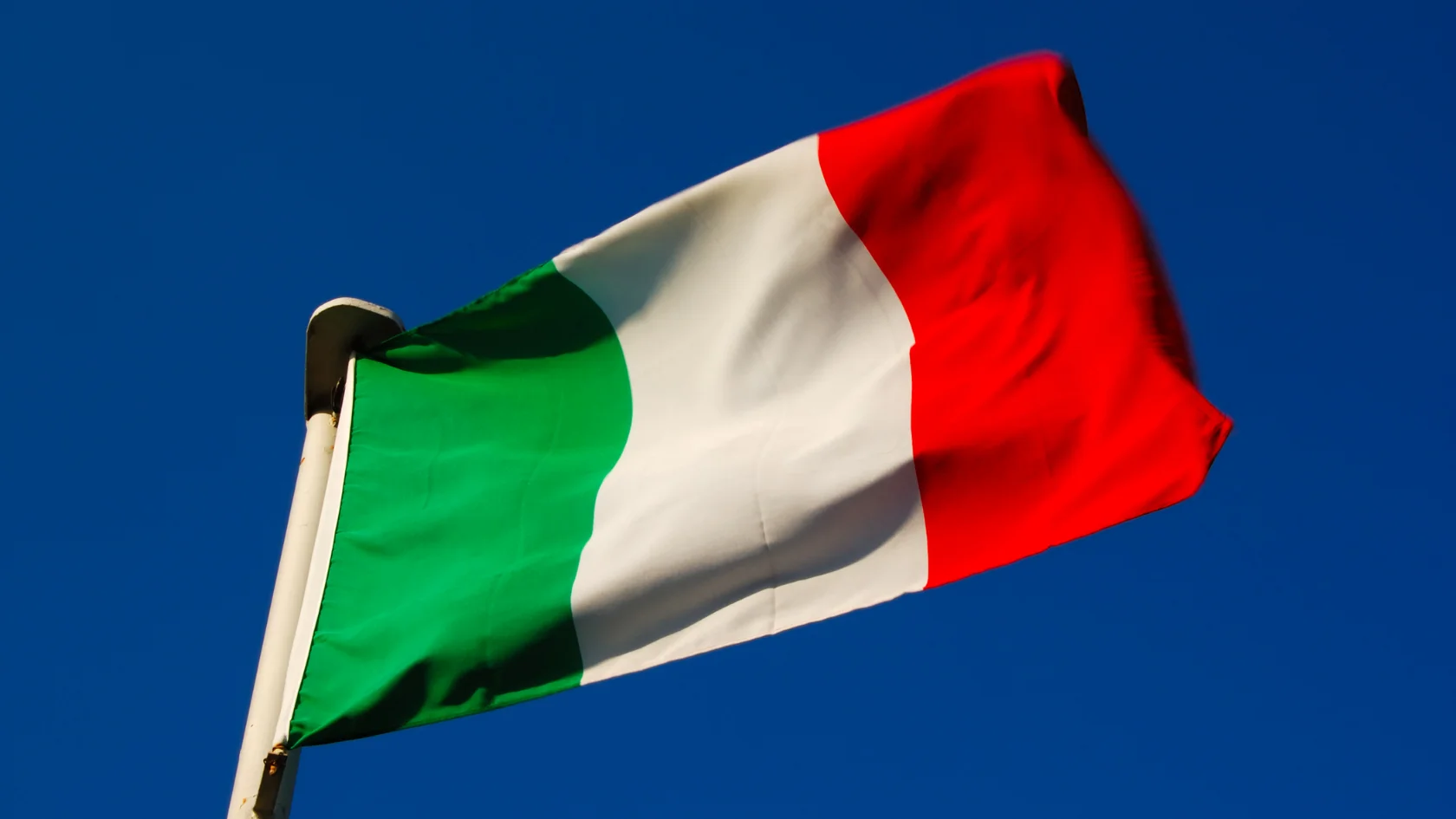 Waving Italian flag symbolizing Italian citizenship by descent