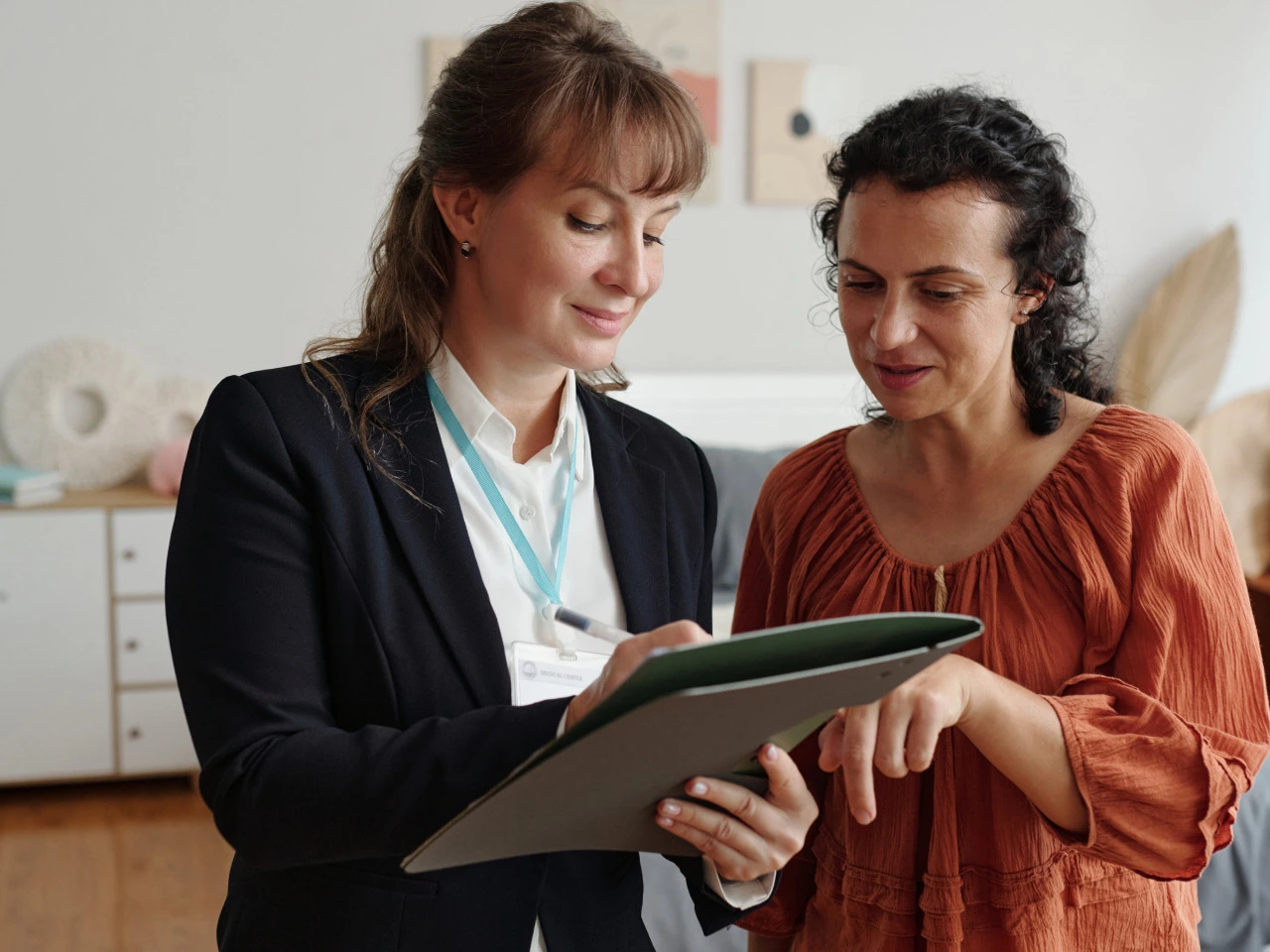 Professional reviewing legal name change requirements with an applicant.