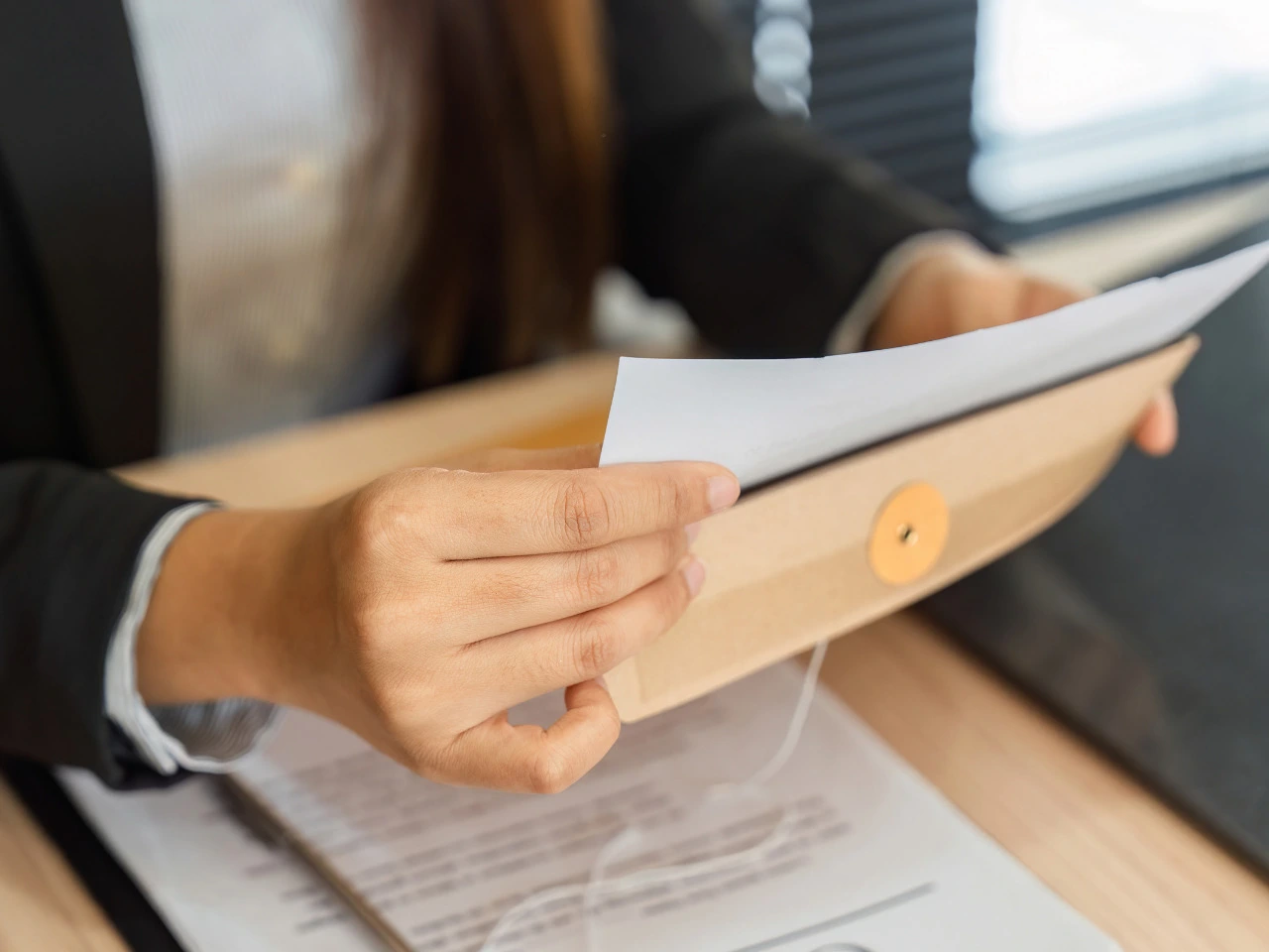 Person holding documents to update after a legal name change.