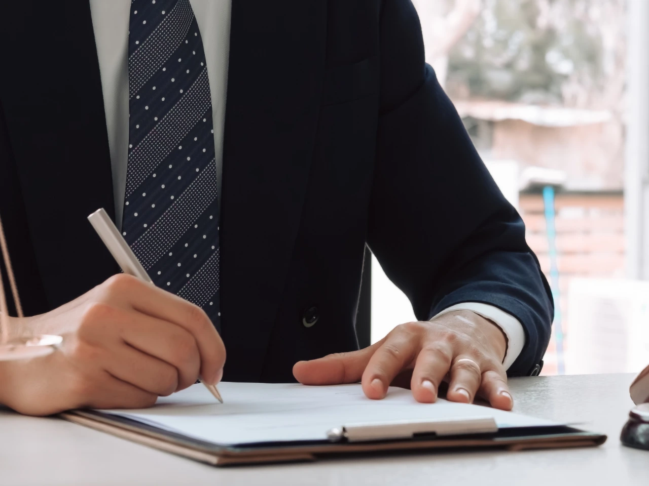 Signing documents for professional translation and localization services.