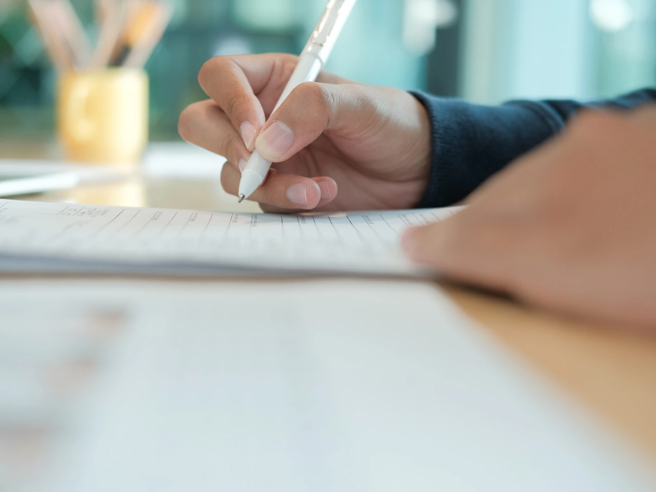 Applicant completing paperwork for a police certificate application.