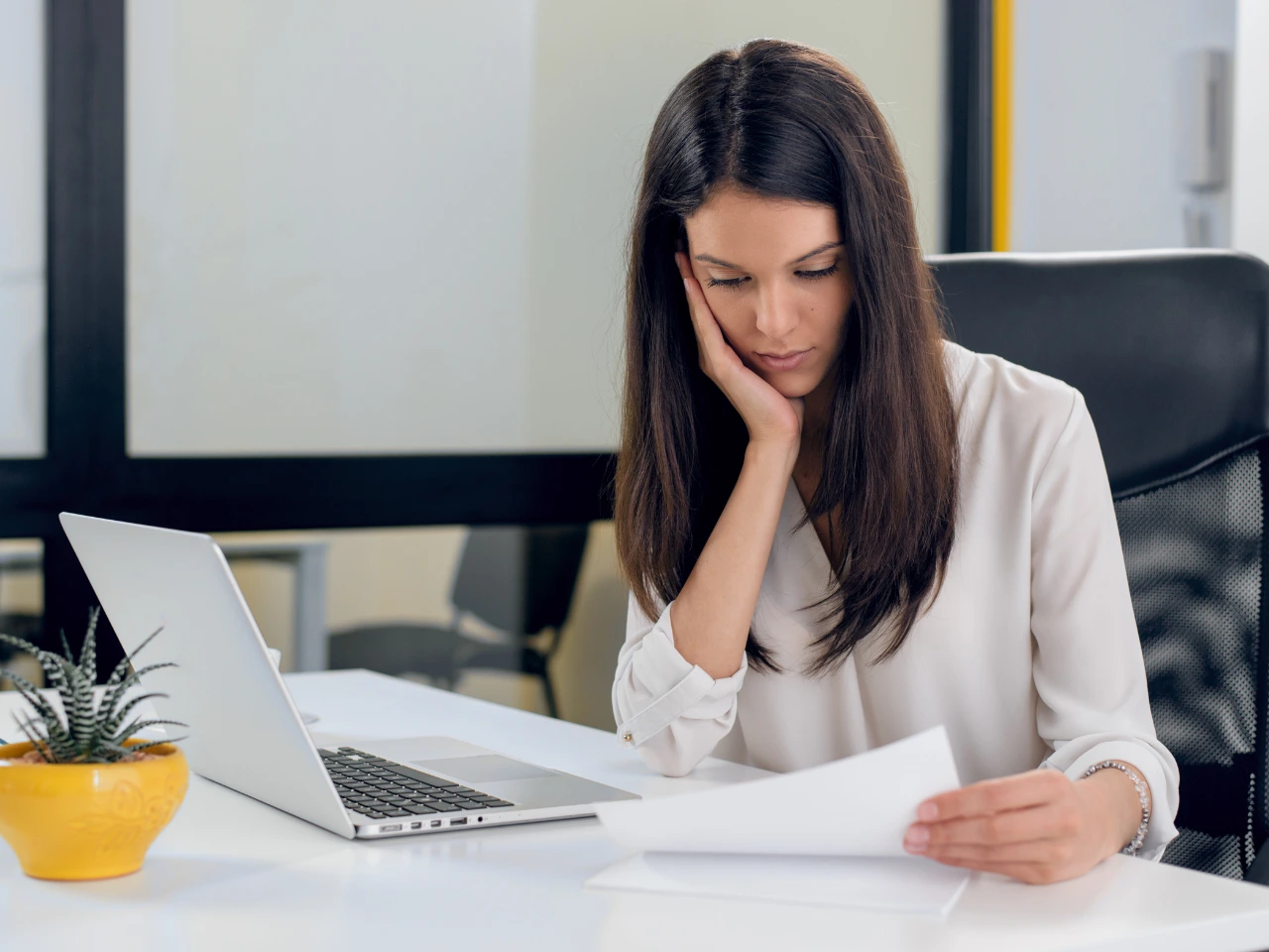 Applicant reviewing immigration documents for a Canadian PR application
