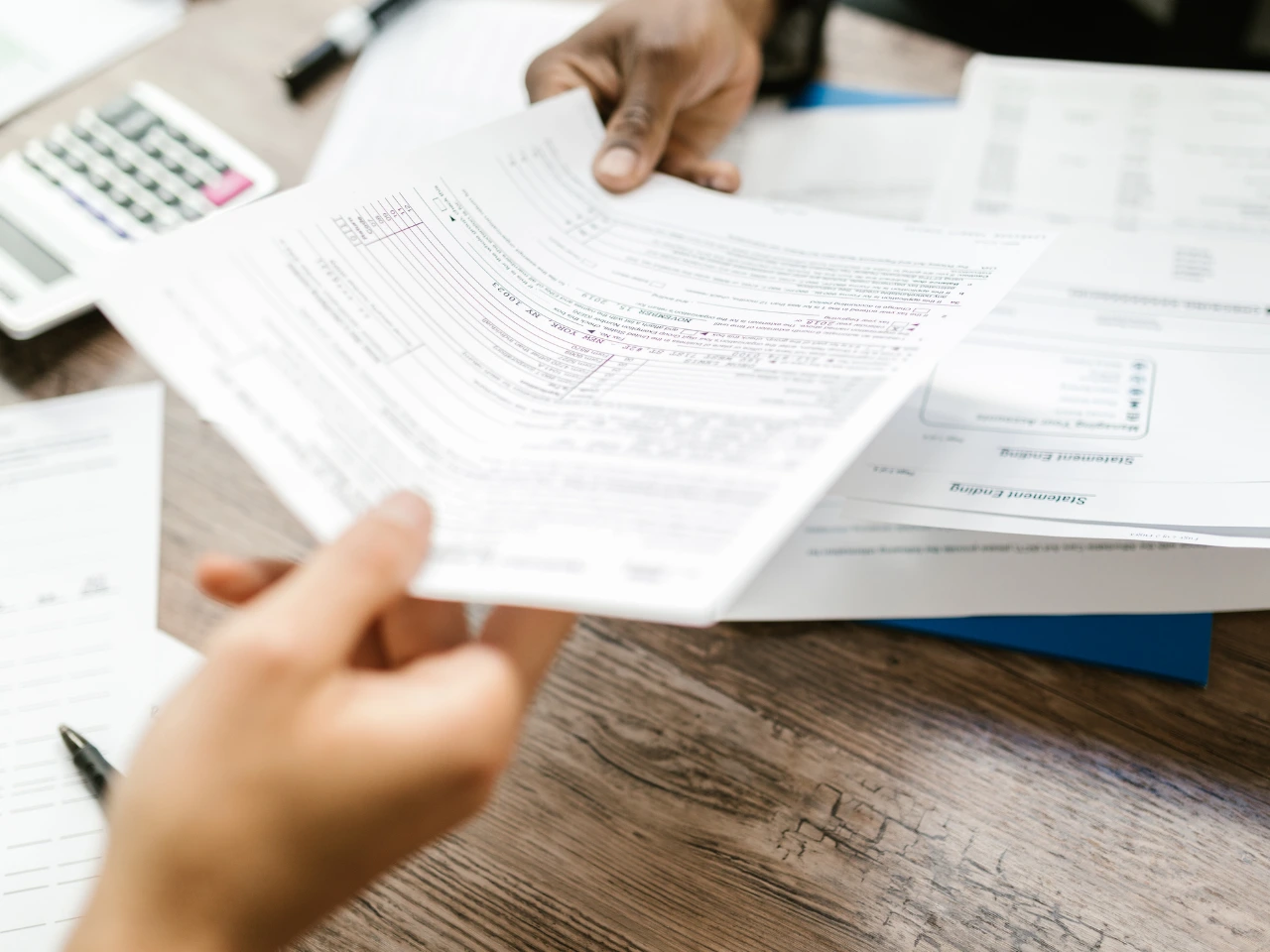 Reviewing travel and immigration documents for returning to Canada.