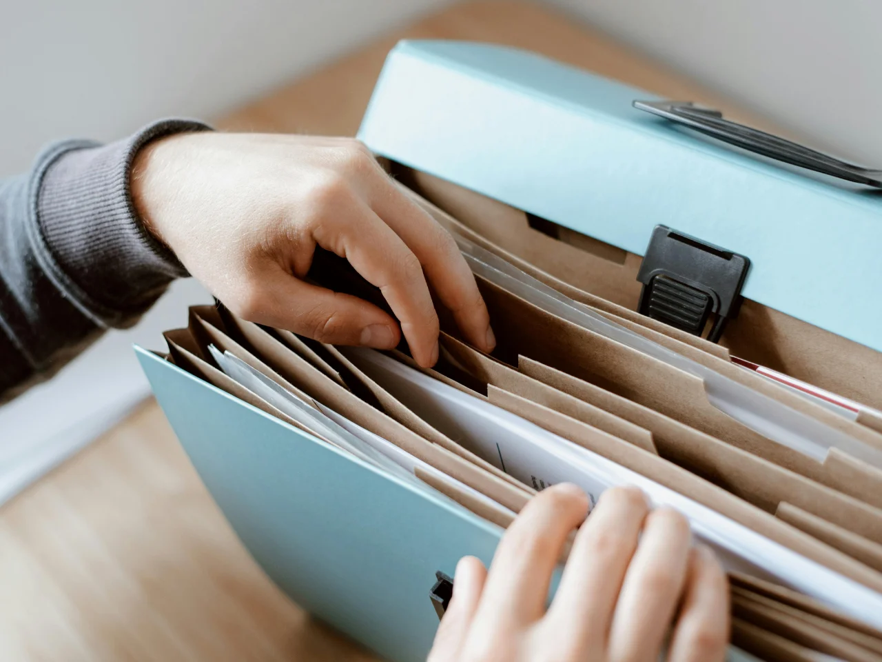 Family documents being organized for a Super Visa application for parents and grandparents.