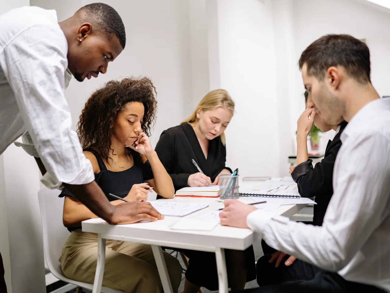 Professionals from diverse backgrounds collaborating in Canada's multilingual workplace.